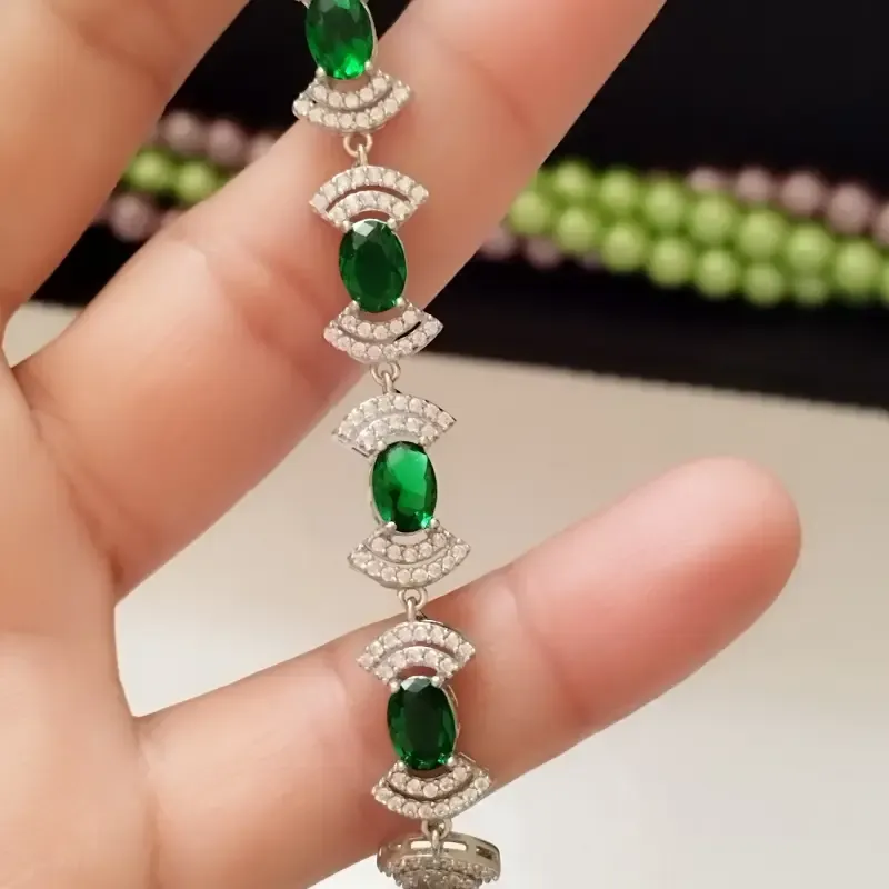 دستبند نقره زنانه عیار 925 با نگین زمرد سنتاتیک و روکش طلا سفید - تصویر 9