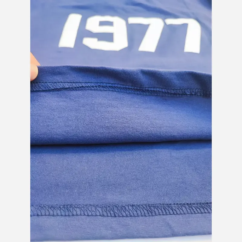 ست تیشرت و شلوارک اسپرت پسرانه و دخترانه طرح 1977 رنگ سرمه ای سایز 55 تا 75 - تصویر 3