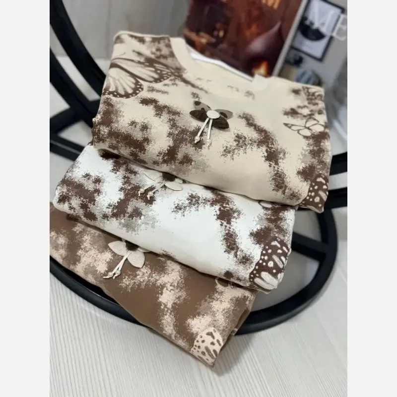 ست بلوز و شلوار دخترانه دورس دونخ لاکرادار طرح پروانه سایز 45 تا 65 رنگ سفید کرم شکلاتی - تصویر 8